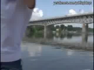 Real amateur brunette has dirty video in public in a boat and eats the cum